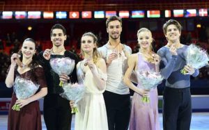 First place Gabriella Papadakis and Guillaume Cizeron of France (C) show their gold medal next to silver medalists Anna Cappellini and Luca Lanotte of Italy (L) and bronze medalists Alexandra Stepanova and Ivan Bukin of Russia after performing at the pairs free dance category of the ISU European Figure Skating Championships on January 29, 2015 in Stockholm. AFP PHOTO/JONATHAN NACKSTRAND